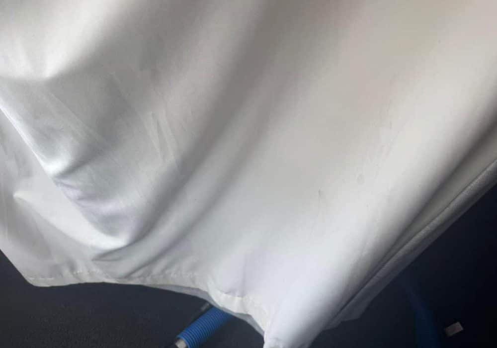 White curtain clean along the hem after curtain cleaning