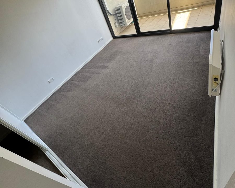 Empty bedroom with freshly cleaned carpet ready for an end of lease inspection
